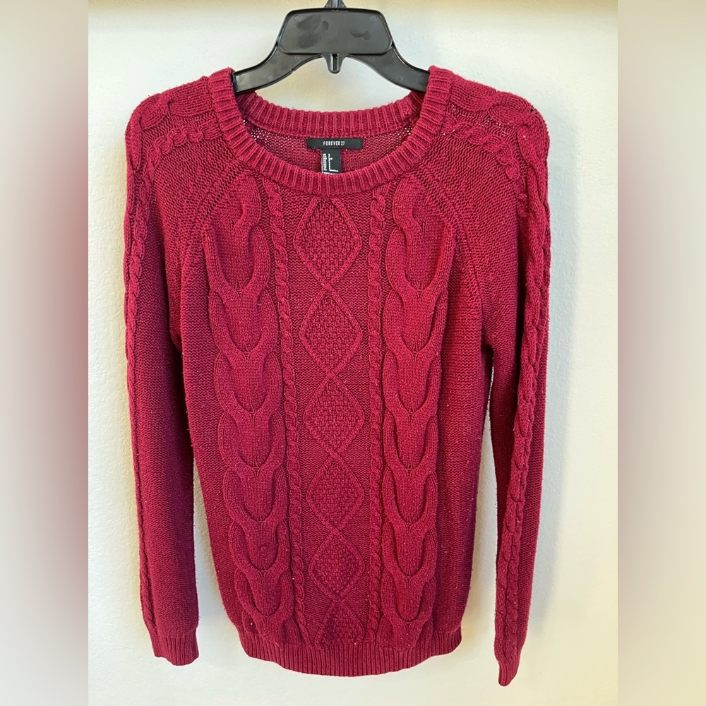 Red lightly worn heavy sweater.